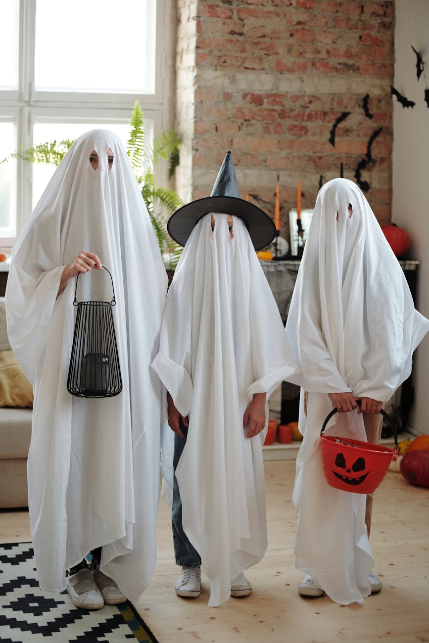 people in ghost costumes