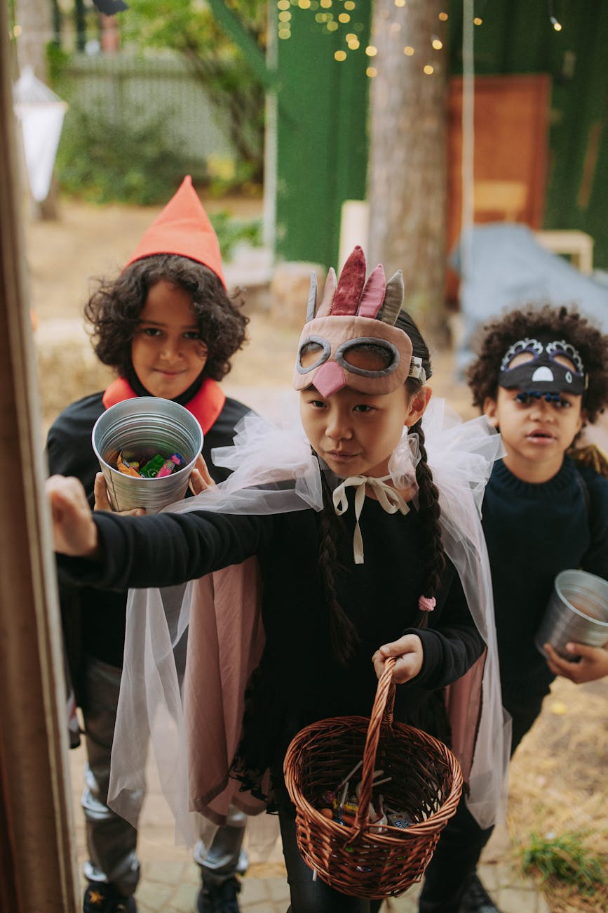 kids wearing halloween costumes