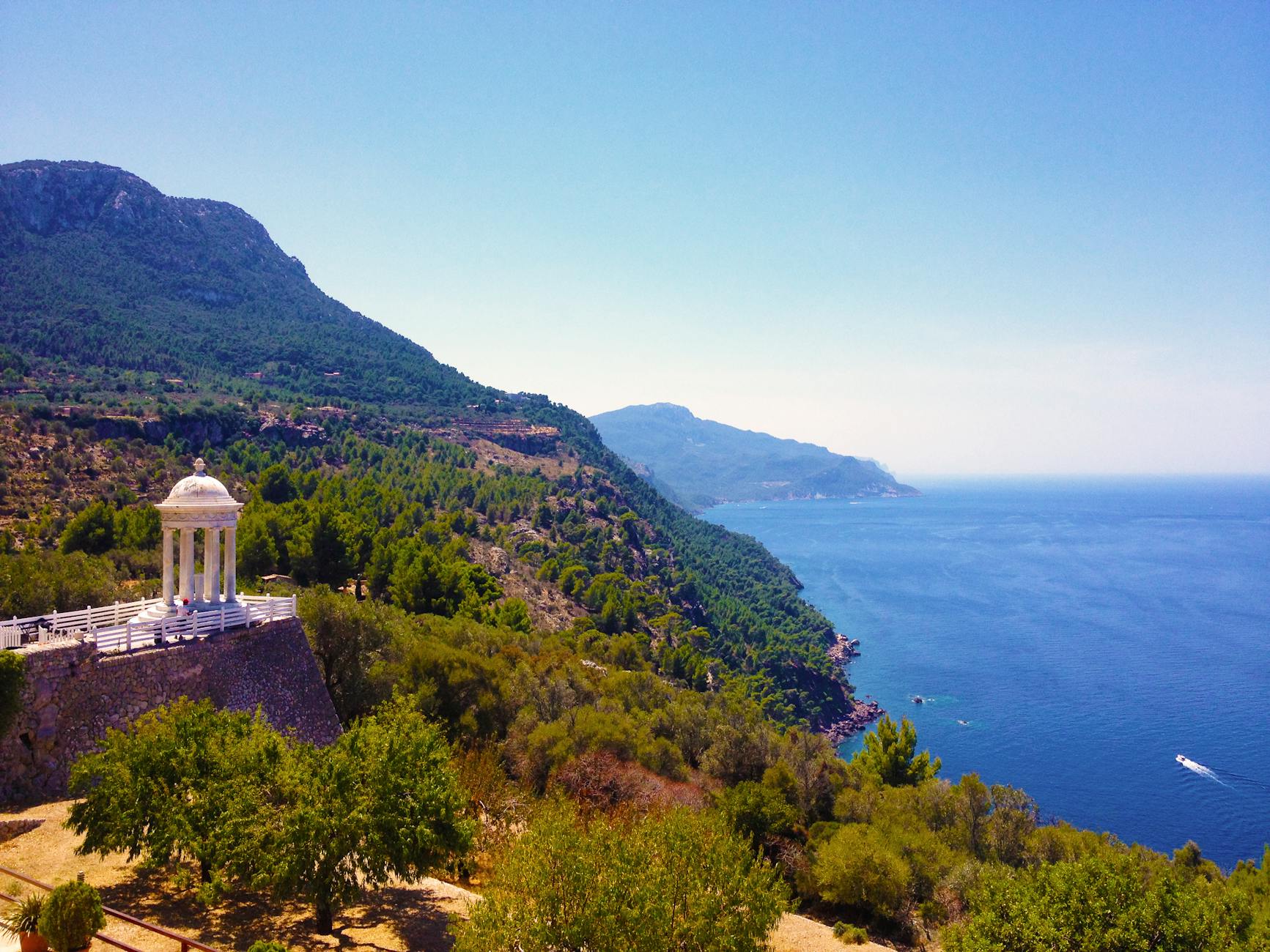 white dome terrace on brown cliff during daytime