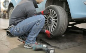 man changing a car tire